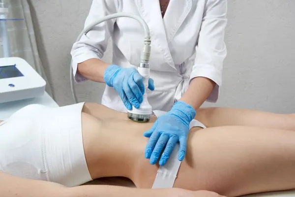 Lost the Weight but Not the Loose Skin? 2 woman having HIFU treatment on her stomach to combat loose skin Earley following weight loss